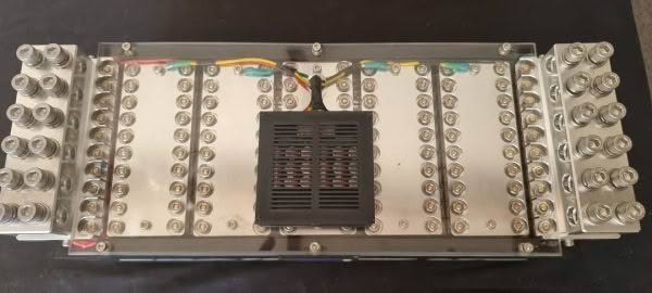 Electrical panel with multiple connectors and wires.