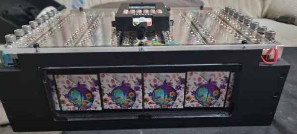 Technical device with colorful panel illustrations.