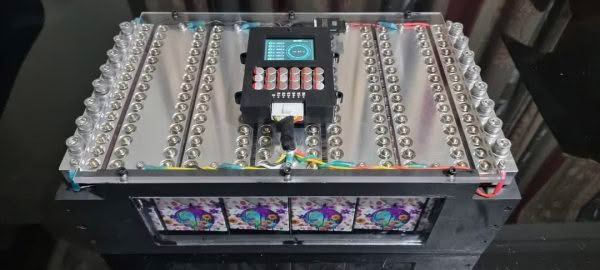 Rectangular electronic device with colorful wiring.