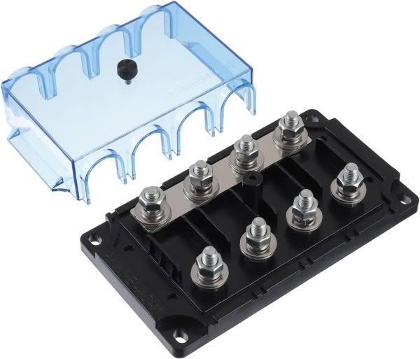 Close-up of the ANL / CNL Fuse Holder with a transparent blue cover on one side and two rows of connectors on a black base. The partially detached cover exposes the terminals beneath.