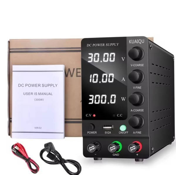 Image of a 30V 10A 300W Adjustable Power Supply with a digital display, knobs, and buttons. In the background are the user manual, box, and cables.
