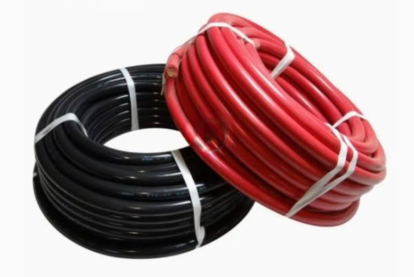 Red and black coils of electrical wire.