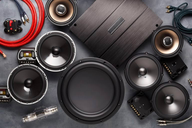 Car audio system components and cables displayed.