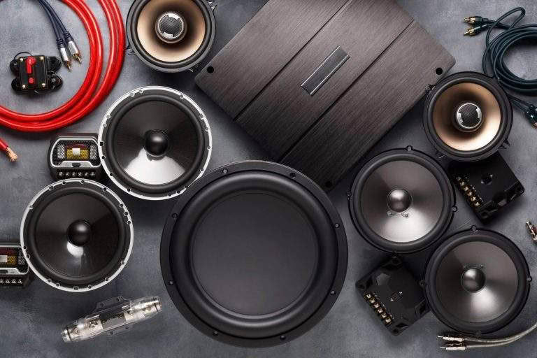 Car audio system components and cables displayed.