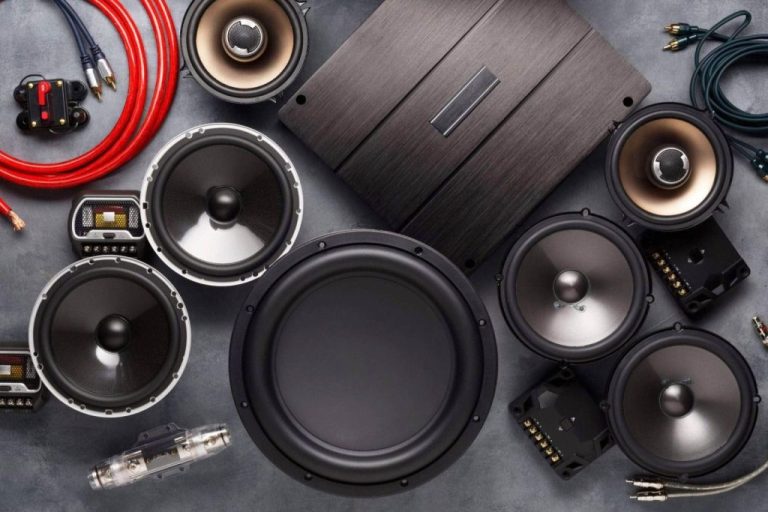 Car audio system components and cables displayed.