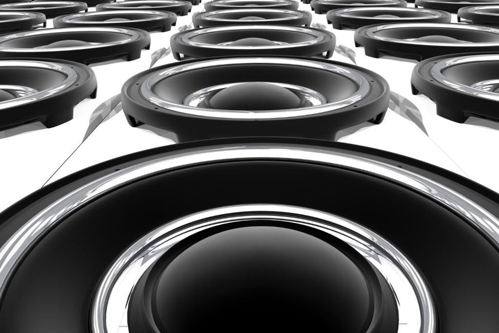 Close-up of multiple black audio speakers.