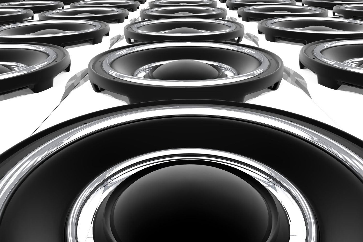 Close-up of multiple black audio speakers.