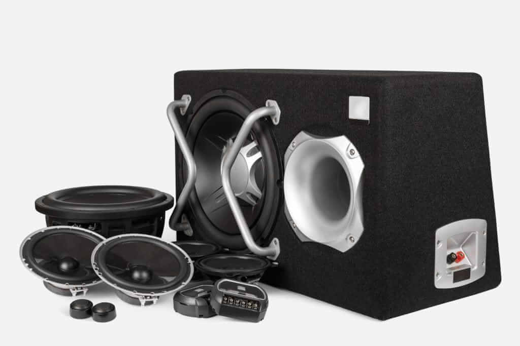 Car audio speaker system with subwoofer in enclosure.