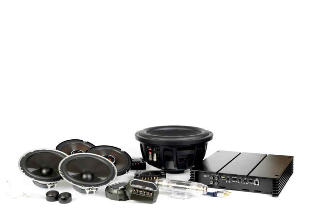 Car audio system components on white background