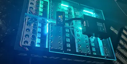 Illuminated electronic device with glowing blue lights.