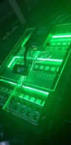 Illuminated circuit board with green lights.