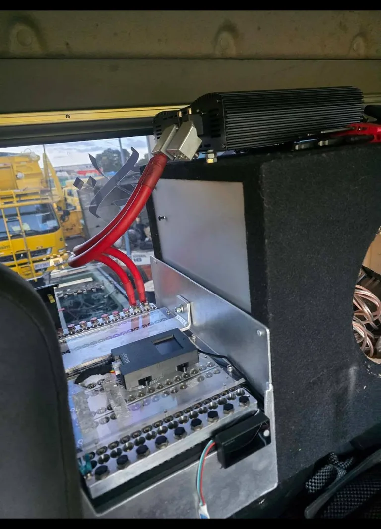 Close-up of the SCiB bank and high-current cabling inside the garbage truck