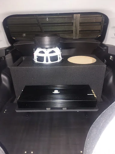 Subwoofer enclosure and amplifier installed in Jared Ansley’s rear cargo area