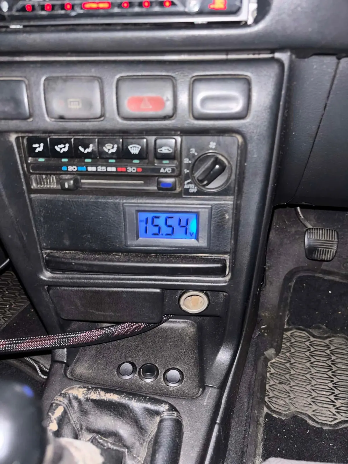 In-car voltage display reading 15.54 volts in Joseph's Nissan Pulsar